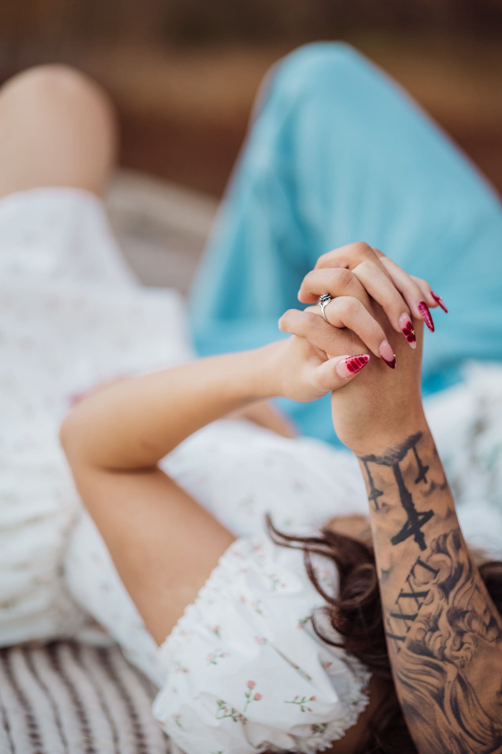 A couple holding hands at a photoshoot